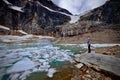 Woman by glacier lake with icebergs. Royalty Free Stock Photo