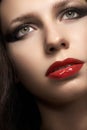 Woman with glamour red lips make-up, eye arrow makeup, purity complexion Royalty Free Stock Photo