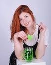 Red haired woman with a glass of green beer. St. Patrick`s Day. Royalty Free Stock Photo