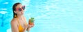 Woman with glass of refreshing drink in swimming pool, space for text. Banner design Royalty Free Stock Photo