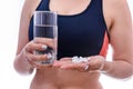 Woman with glass of water and pills in bottle isolated Royalty Free Stock Photo