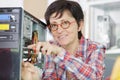 woman with glasses fixing broken processor Royalty Free Stock Photo