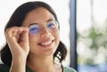 Woman, glasses and portrait with eyes, optometry and health with smile, choice and fashion in store. Girl, frame and