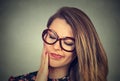 Woman in glasses with sensitive toothache crown problem about to cry from pain Royalty Free Stock Photo