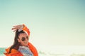 Woman in glasses smiles against the background of the sea and sky Royalty Free Stock Photo