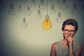 Woman with glasses thinking hard looking for right solution Royalty Free Stock Photo