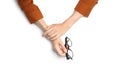 Woman with glasses on white background, top view. Closeup of hands Royalty Free Stock Photo