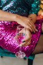 woman glittery red dress glass champagne toast