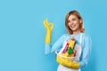 woman in gloves holding bucket of detergents and showing Ok Royalty Free Stock Photo