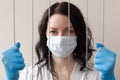 A woman in gloves and a protective mask Royalty Free Stock Photo
