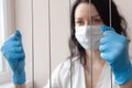 A woman in gloves and a protective mask Royalty Free Stock Photo