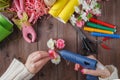 Woman glue handmade flowers with melt gun Royalty Free Stock Photo