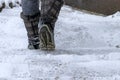 A woman goes down a staircase in winter. Royalty Free Stock Photo