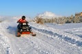 The woman goes on a snowmobile Royalty Free Stock Photo