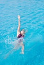 Woman in goggles swimming back crawl style Royalty Free Stock Photo