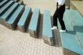 A woman going across steps with a gap in them