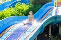 Woman going down a water slide Royalty Free Stock Photo