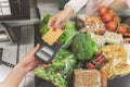 Woman going to make payment in supermarket