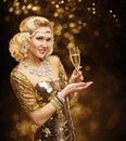 Woman in Gold Dress drinking Champagne, Beautiful Retro Fashion Royalty Free Stock Photo