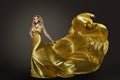 Woman Gold Dress, Fashion Model Dancing in Long Silk Gown Royalty Free Stock Photo