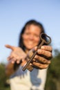 Woman gold key in hand blue sky Royalty Free Stock Photo