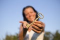 Woman gold key in hand blue sky Royalty Free Stock Photo