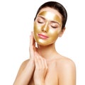 Woman Gold Mask, Beautiful Model with Golden Skin Cosmetic touch Face, Beauty Skincare and Treatment