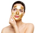 Woman Gold Mask, Beautiful Model Removing Golden Facial Skin Cosmetic, Beauty Skincare and Treatment Royalty Free Stock Photo