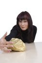 Woman with a gold nugget Royalty Free Stock Photo