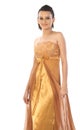 Woman with golden color long gown Royalty Free Stock Photo