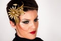 Elegant Beauty: Woman with Golden Flower Hairpin and Stunning Make-up