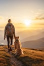 Woman with golden retriever dog hiking in mountain top in the morning. Beautiful landscape. Travel and freedom concept Royalty Free Stock Photo