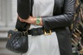 Woman with golden Rolex Daydate with green strap before Emporio Armani fashion show, Milan