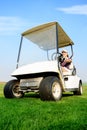 Woman in golf cart Royalty Free Stock Photo