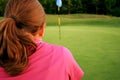 Woman on golf course Royalty Free Stock Photo