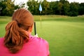 Woman on golf course Royalty Free Stock Photo