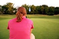 Woman on golf course Royalty Free Stock Photo