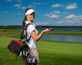 Woman on a golf field Royalty Free Stock Photo