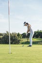 Woman golf player concentrating. Royalty Free Stock Photo