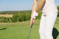 Woman golf player concentrating. Royalty Free Stock Photo