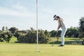 Woman golf player concentrating. Royalty Free Stock Photo