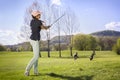 Woman golf player pitching. Royalty Free Stock Photo
