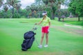 Woman golfer playing golf on the field Royalty Free Stock Photo