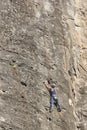 Female climber on a granite wall. Extreme sport. Outdoor activity