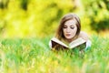 Woman grass reading book Royalty Free Stock Photo