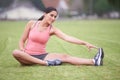 Woman, grass and stretching legs in portrait with exercise, training or fitness for health in summer. Girl, person and