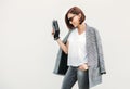 Woman in gray and black city casual outfit