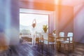 Woman in gray dining room corner Royalty Free Stock Photo