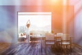 Woman in gray dining room interior Royalty Free Stock Photo