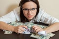 Woman with greedy person hugs a lot of money